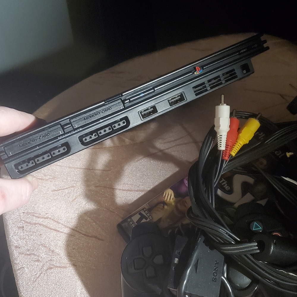 PS2 with games, wires, controllers and more